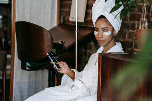 Woman using at-home beauty gadget for LED skincare routine
