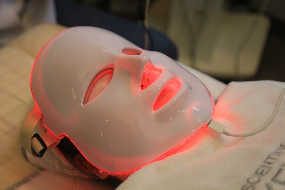 Woman safely wearing LED face mask at home during skincare routine